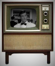 an old fashioned television with a man on it