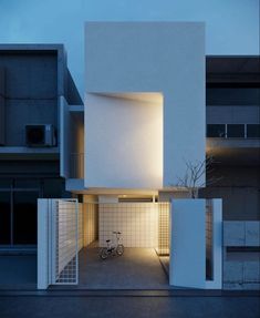 a bike is parked in front of a white building