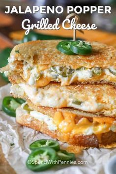 two grilled cheese sandwiches stacked on top of each other with jalapeno poppers