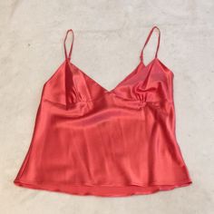 This Luxurious Silk Camisole Is By Moda International. It Is A Size Small And Features Adjustable Spaghetti Straps And An Invisible Side Zipper. It Is A Beautiful Shade Of Salmon And Is 92% Silk And 8% Spandex For A Comfy Fit. Elegant Pink Camisole With Built-in Bra, Elegant Pink Tops With Built-in Bra, Solid Color Cami Tank Top For Party, Cami Tank Top For Party, Spring Night Out Camisole With Built-in Bra, Feminine Sleeveless Camisole For Party, Pink Spaghetti Strap Camisole With Built-in Bra, Pink Cami Tank Top With Built-in Bra, Chic Fitted Pink Tank Top