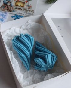 an open box with some blue icing in it