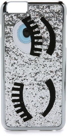 an iphone case with black and white designs on the front, and blue eyeball in the middle