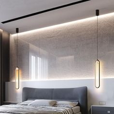 a bed sitting under two lights in a bedroom