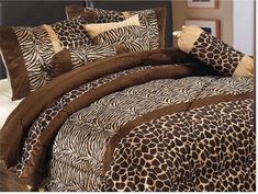 a bed with leopard print and brown pillows