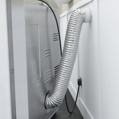 a shower head is attached to the side of a wall with a hose running through it