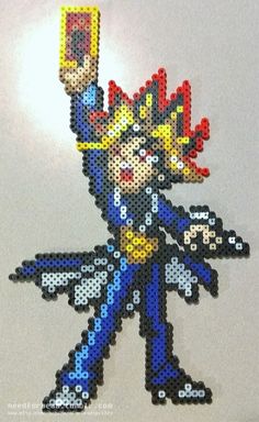 an image of a pixel art character made out of beads