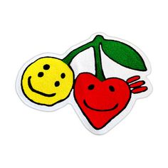 a sticker with two cherries and a smiley face