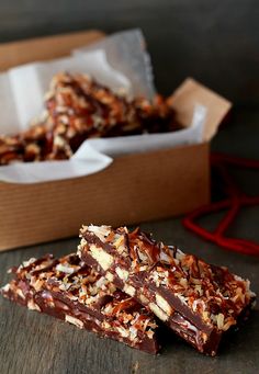 some kind of food that is in a box on a table with it's wrapper