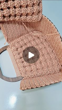 a crocheted bag sitting on top of a table