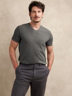 This classic v-neck t-shirt is cut from our Luxury-Touch cotton jersey—beloved for its signature softness and a smooth finish that leans more dressed-up in appearance.  V-neck.  Straight hem with vented sides.  Standard fit.  Short sleeves.  Hits at the hip.  Model: Size M, 6'2" (188cm). Mens Business Casual, V Neck Tshirt, Business Casual Men, Fashion Story, Curator Style, Daily Fashion, Charcoal Grey, Black And Navy, Banana Republic