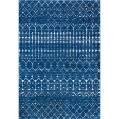 a blue and white rug with an abstract design