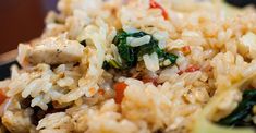 rice with meat and vegetables is served on a plate