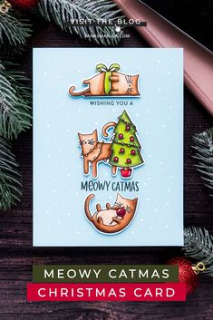 a christmas card with the words merry catmas on it and an ornament