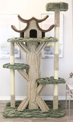 a cat tree with two cats in it and one on the other side that is made to look like a tree