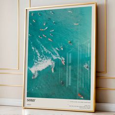 an aerial view of surfers swimming in the ocean