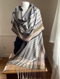 This large silk wrap is 20" by 84" and can be worn as a shawl or a large scarf. Each of my scarves and wraps is handwoven and one of a kind.I begin with pure silk, then dye it, warp it and weave it. The silk is exceptionally soft to the touch, with an elegant, soft drape.   My scarves and shawls are lightweight, breathable, yet warm. They can be warm in fall, winter and spring, and even on cool summer evenings.   They can be dry cleaned, or hand washed in cool water, with a mild soap. Silk Shawl Scarf One Size, Elegant Silk Handloom Shawl, Bohemian Silk Shawl, Silk Shawl Scarf, Handmade Silk Shawl Scarf, Bohemian Silk Shawl Scarf, Handmade Elegant Silk Shawl, Elegant Handmade Silk Shawl, Handmade Silk Bohemian Shawl