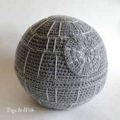 a crocheted ball sitting on top of a white table