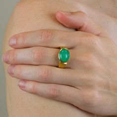 Loved for its bright, vivid apple-green color, this understated gemstone will add a subtle pop of color to your everyday look. The gorgeous Chrysoprase ring is known for activating, opening, and energizing the heart chakra allowing its wearer to bring the energy that is necessary to the physical body, through the loving energy of the heart. Chrysoprase facilitates adaptability and self-acceptance. In history this Chrysoprase gemstone was also popular; Worn by Alexander the Great on his belt as a Fine Jewelry Chrysoprase Ring, Vintage Chrysoprase Ring Jewelry, Polished Chrysoprase Ring Jewelry, Luxury Handmade Chrysoprase Ring, Green Chrysoprase Cabochon Rings, Apple Green Color, Chrysoprase Ring, Loving Energy, Green Ring