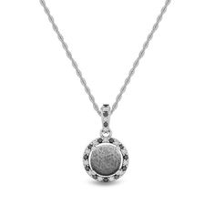 Shine bright with this one-of-a-kind meteorite pendant. The pendant features dazzling diamond accents of black and white. Perfect, Gibeon Meteorite, with it's gorgeously unique pattern, stands strong as the center of attention.The meteorite pendant shows a fantastic Widmansttten pattern. It has been etched with an acid to reveal the characteristic patterns, or Widmansttten figures, of iron meteorites. No two etched meteorites will have the exact same pattern.DETAILS OF THE PENDANT Chain: .50 mm White Gold Pendant Jewelry, White Diamond Jewelry, Meteorite Necklace, Gibeon Meteorite, Meteorite Jewelry, Jewelry By Johan, Meteorite Pendant, Iron Meteorite, Halo Necklace