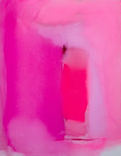 an abstract painting in pink and white with a small red object on the bottom right corner