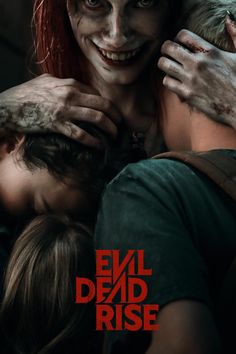 the evil dead rise movie poster with two people hugging each other in front of them