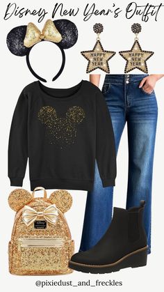 a woman in black shirt and jeans wearing mickey mouse ears