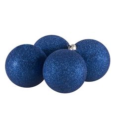 three blue glittered balls on a white background