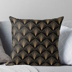 a black and gold art deco design throw pillow