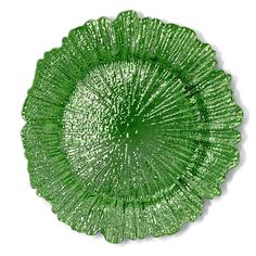 a green glass plate sitting on top of a white table