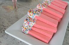 there are many pink waffles that have sprinkles on top of them