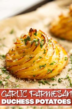 garlic parmesan potatoes on a cutting board with text overlay that says garlic parmesan