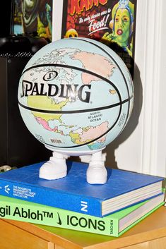 a basketball sitting on top of a stack of books