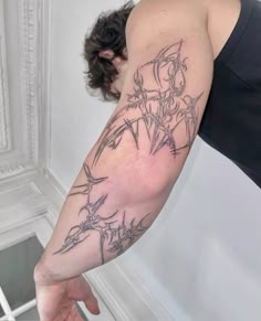 a person with a tattoo on their arm