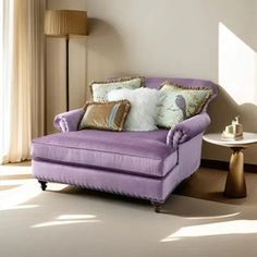 a living room with a purple chair and pillows on the back of it's arm