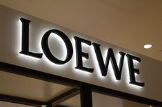 a store sign that reads loewe on it