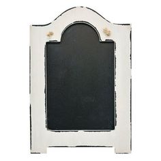 an old white frame with a black board in the middle