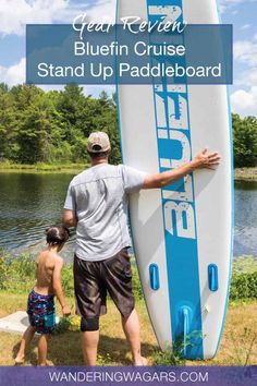 a man and child standing next to a blue and white surfboard with text overlay that reads, gear review bluefin cruise stand up paddleboard