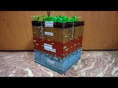 a planter made out of cardboard sitting on top of a table