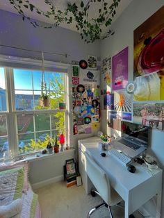 a bedroom with a desk, chair and large window