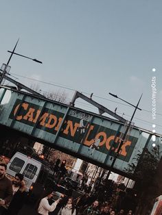 people are walking under an overpass with the words laidin'lock on it