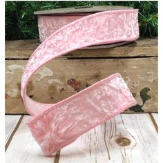 pink velvet ribbon on wooden background