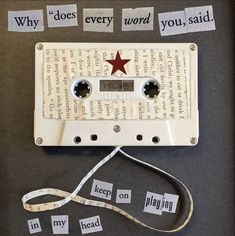 an old cassette tape recorder with words taped to it and a red star on top