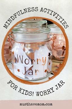 a jar filled with lots of different items on top of a white tablecloth that says, mindfulness activities for kids worry jar