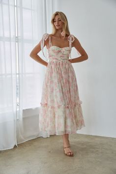 You'll love how you look in the Celine Floral Tie Strap Bustier Maxi Dress! This stunning dress features a feminine floral print, adjustable bow straps, a bustier style top, and a ruffle hem. Pair with a simple heel to complete the look! Details 100% Polyester Built in padding Tie straps Silicone grips Smocked back Back zipper Hand wash cold / Dry flat Floral Maxi Tie-strap Dress, Bridal Tea Party Outfit, Hoco Fits, Garden Party Dresses, Mila Dress, Wedding Guest Outfit Inspiration, Hoco 2024, Dress With Tie Straps, Tie Strap Dress