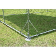 an image of a baseball batting cage in the grass