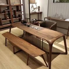 a wooden table and bench in a room