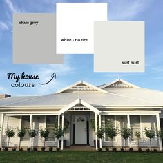 the exterior of a house with white and gray paint colors on it's walls