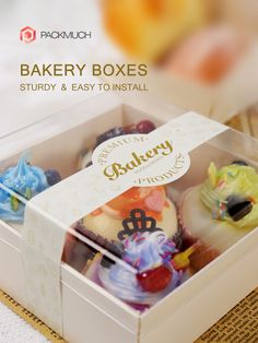 the bakery boxes are filled with different types of cupcakes