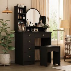 a dressing table with a mirror and stool in front of a window next to a potted plant