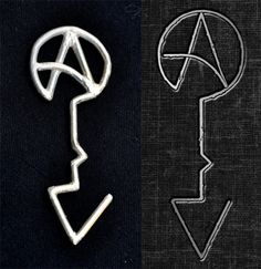 an image of a metal key with the letter q in it's middle and another one